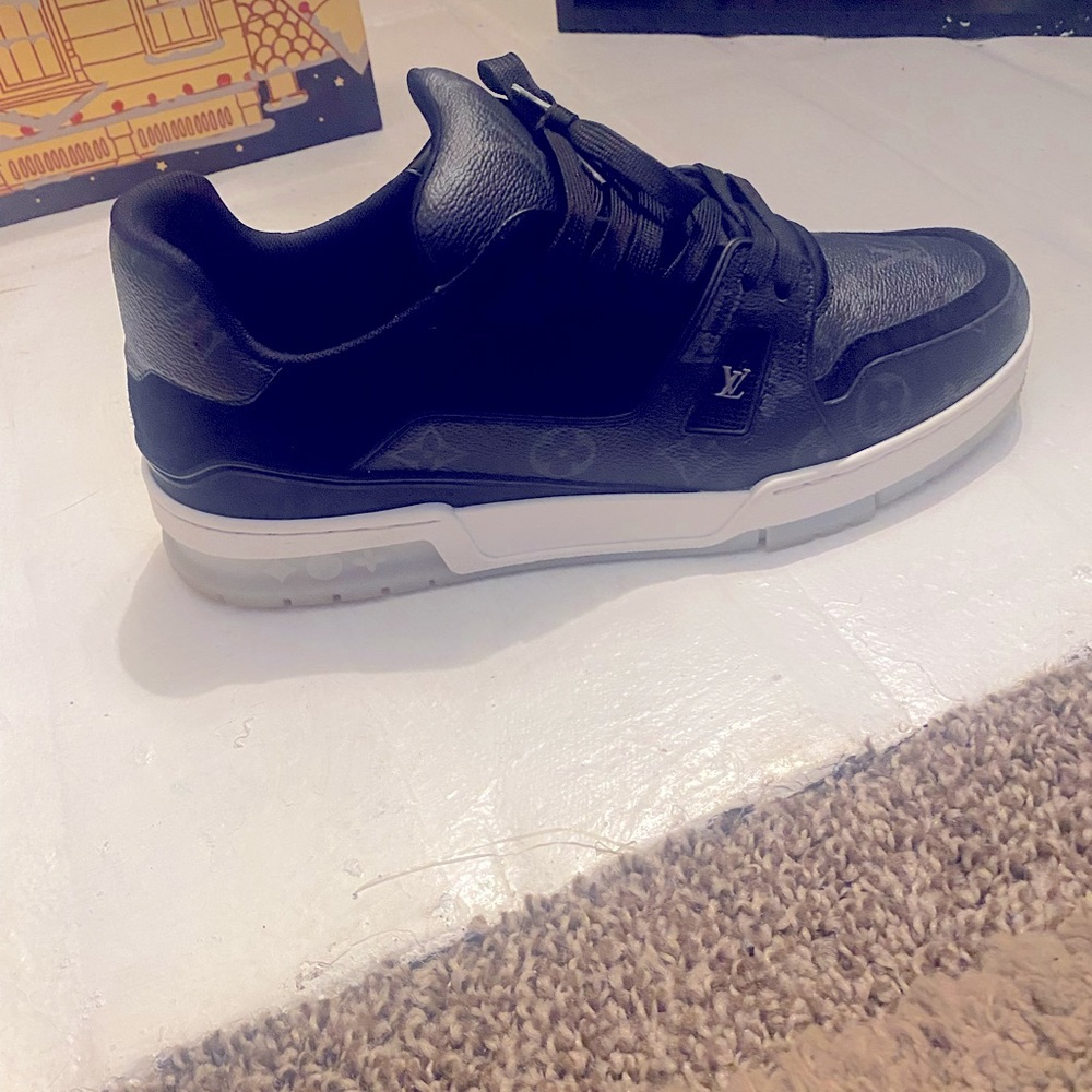 LV Trainers Mens size 9.5. Used but like new. No creases or scratches.
